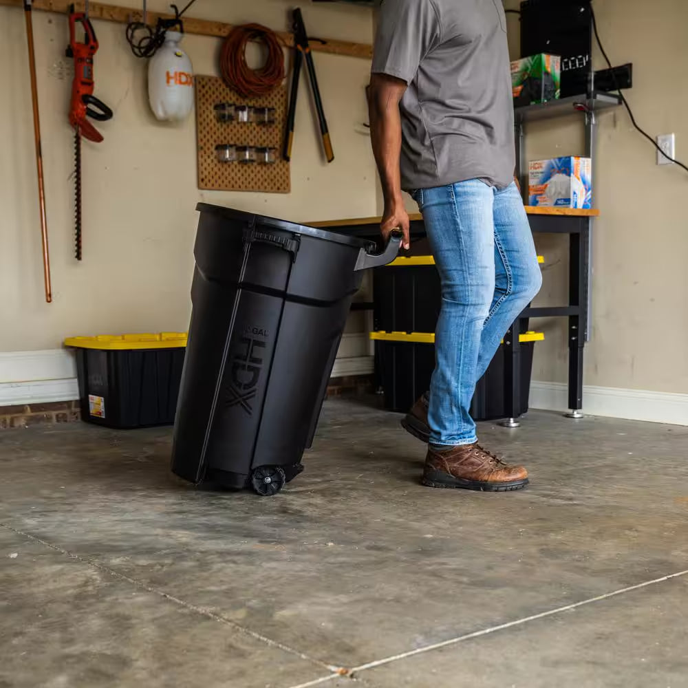 32 Gal. Black Outdoor Vented Trash Can with Wheels, Domed Lid, Rounded Handles, and Reinforced Foothold