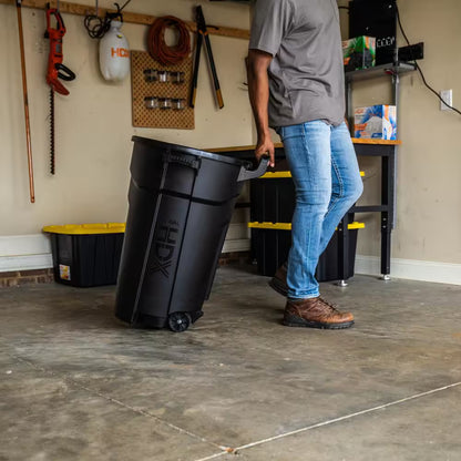 32 Gal. Black Outdoor Vented Trash Can with Wheels, Domed Lid, Rounded Handles, and Reinforced Foothold