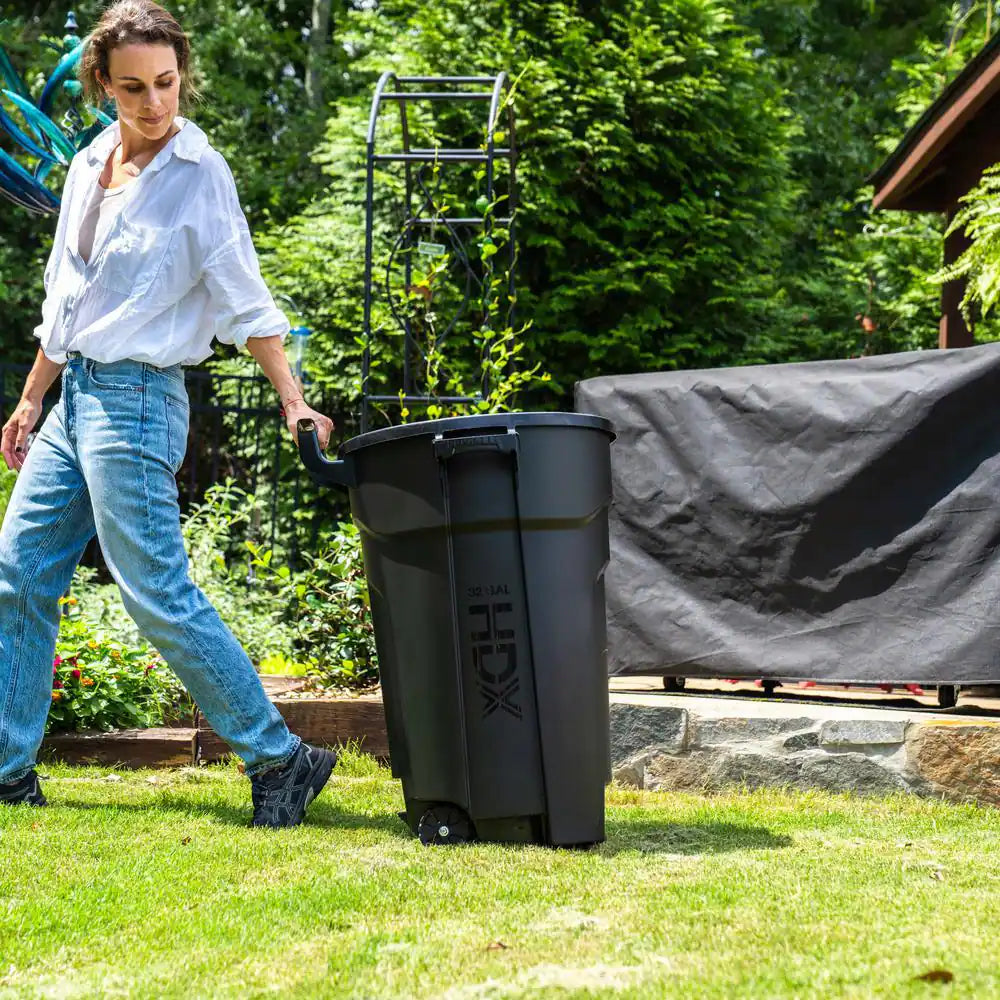 32 Gal. Black Outdoor Vented Trash Can with Wheels, Domed Lid, Rounded Handles, and Reinforced Foothold