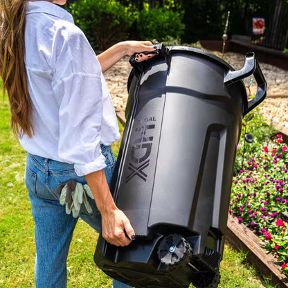 32 Gal. Black Outdoor Vented Trash Can with Wheels, Domed Lid, Rounded Handles, and Reinforced Foothold