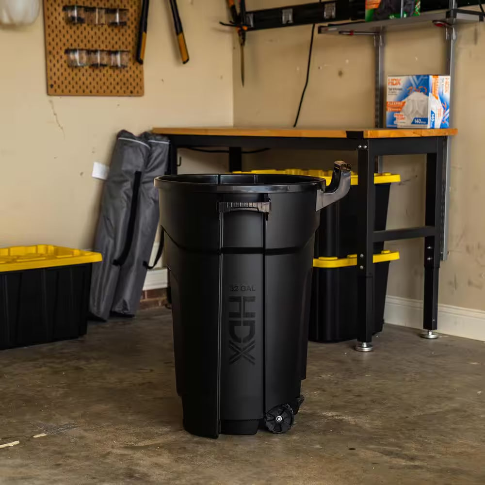 32 Gal. Black Outdoor Vented Trash Can with Wheels, Domed Lid, Rounded Handles, and Reinforced Foothold